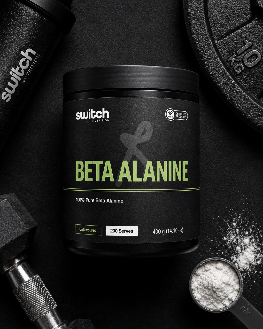 Black container of Switch Nutrition Beta Alanine supplement on a dark surface with fitness equipment.