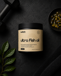 Container of ultra fish oil with capsules on a dark surface