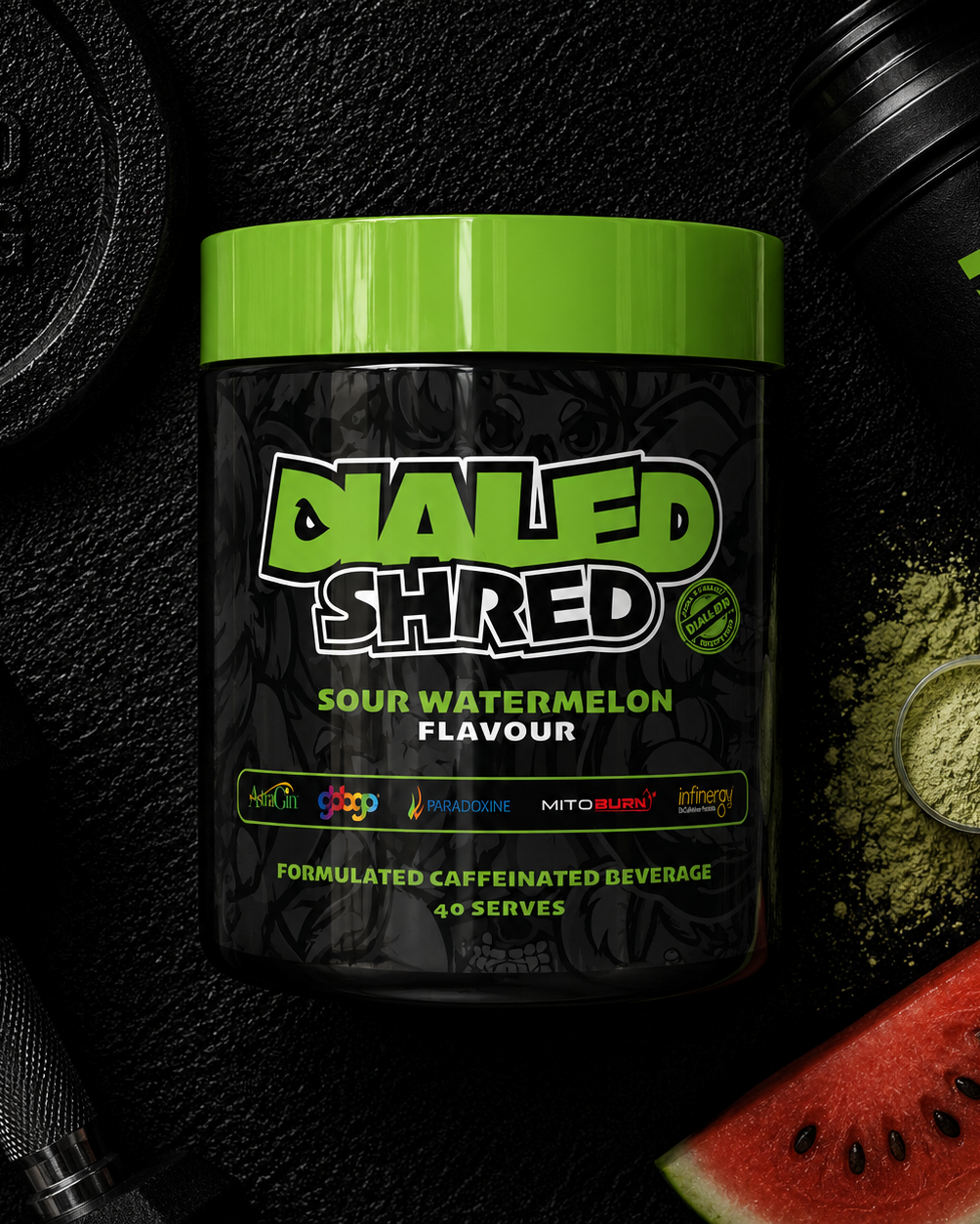 Container of Dialed Shred supplement with watermelon flavor on a black background