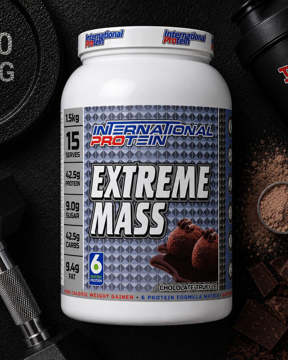 International Protein Extreme Mass supplement container with gym equipment and chocolate pieces on a dark background