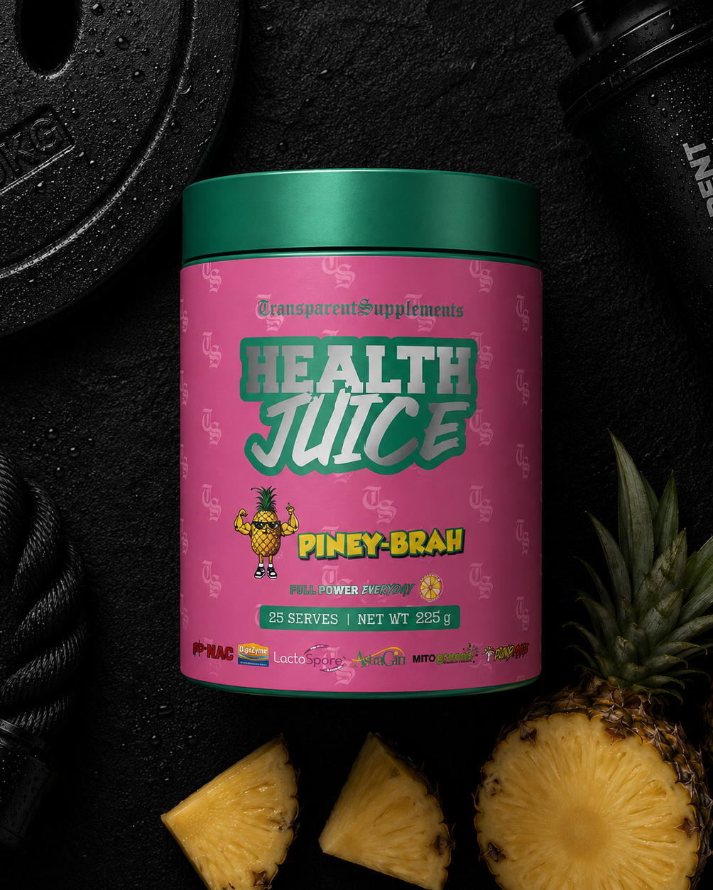 Pink supplement container labeled 'Health Juice Piney Brah' with a pineapple and gym equipment on a black background
