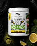 White Wolf Nutrition Greens supplement container with lemon, pomegranate, and other fruits and vegetables on a dark background.