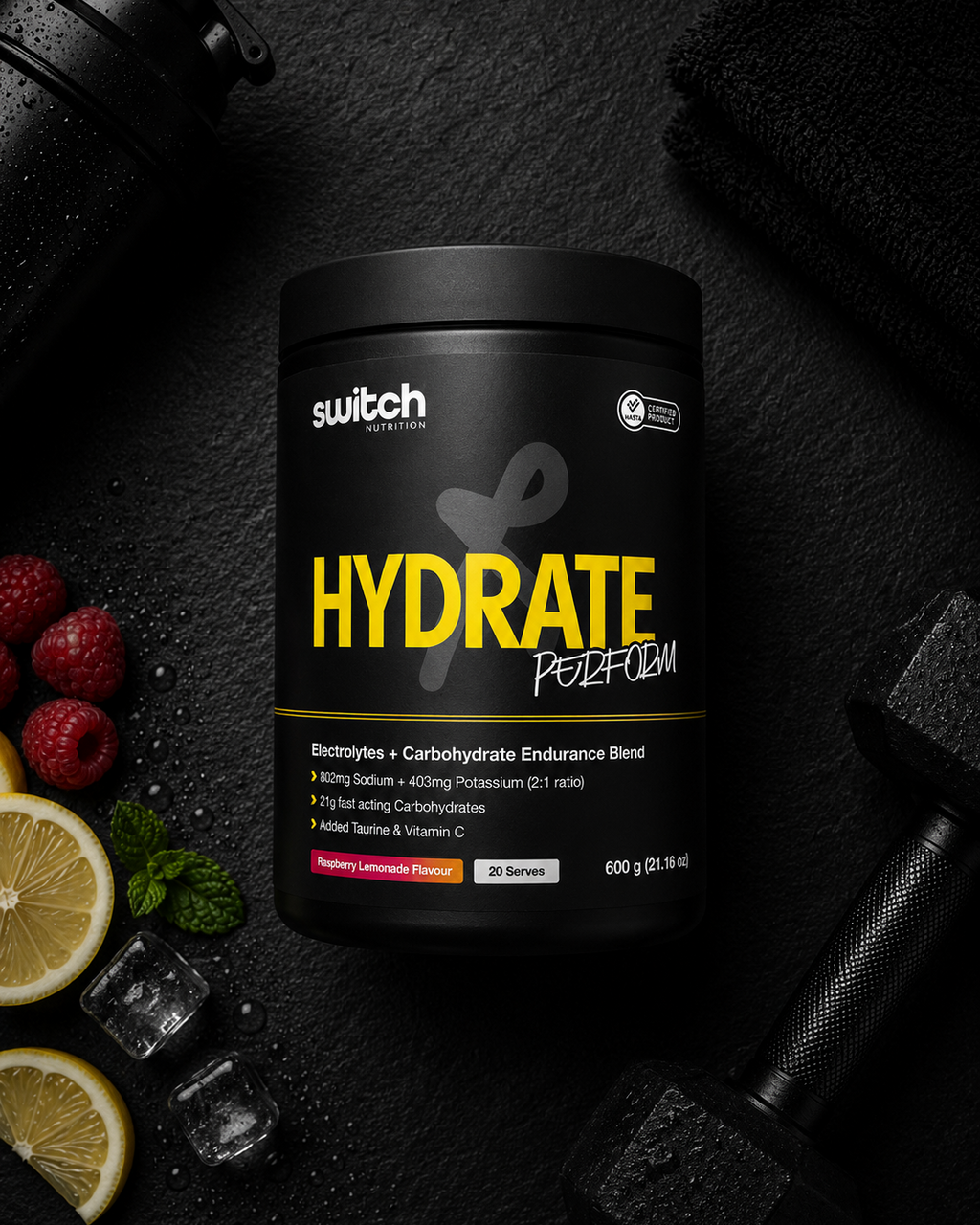 Switch Nutrition Hydrate Perform supplement container on a dark background with fruits and gym equipment.