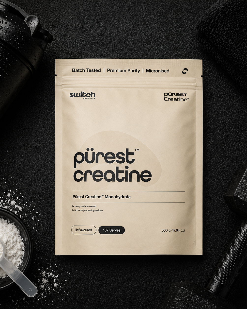 Package of 'purest creatine' with a shaker and scoop on a dark background