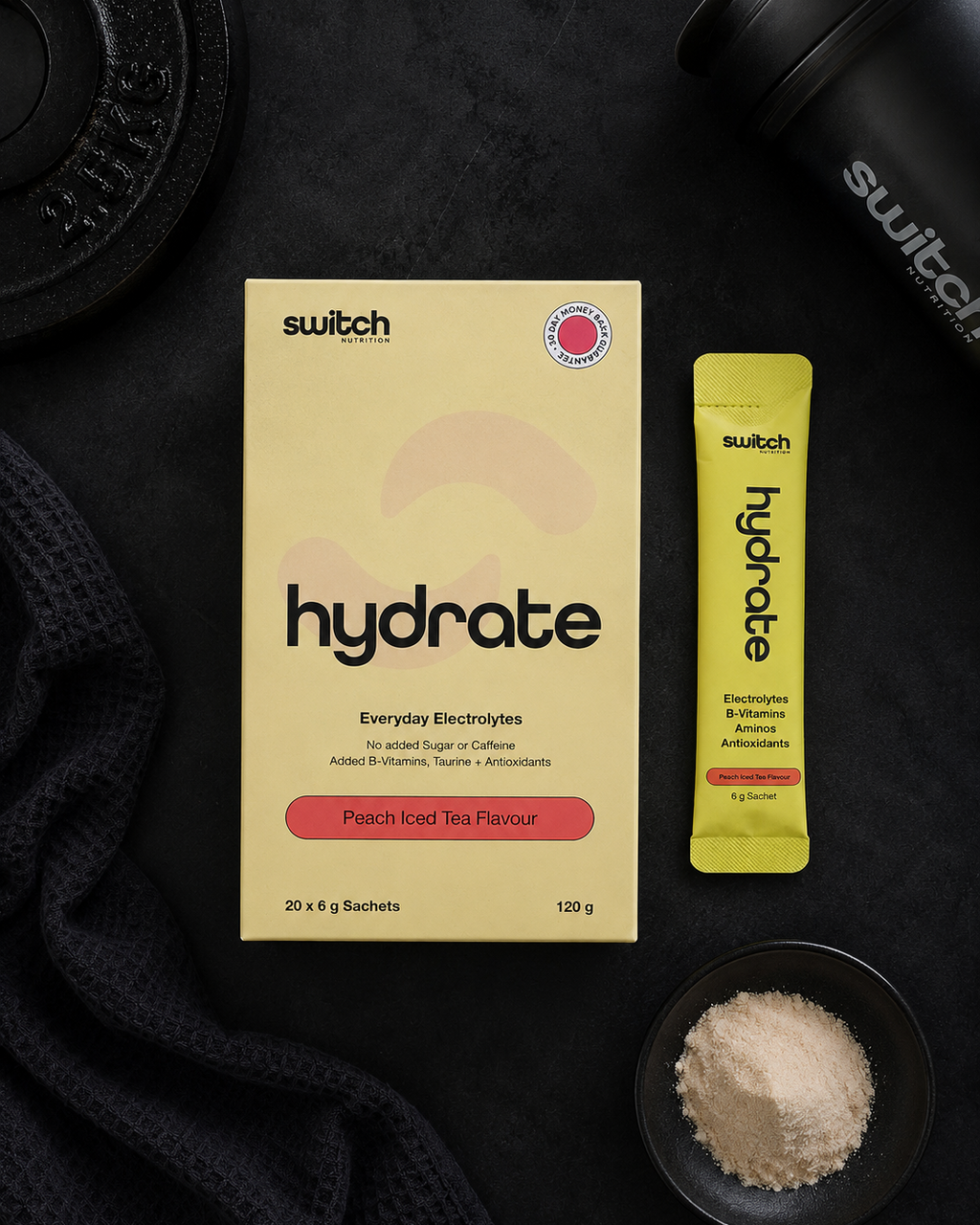 Switch Hydrate electrolyte powder packaging and stick pack on a dark surface