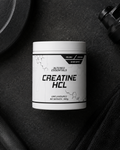 Container of Altered Essentials Creatine HCL on a dark surface with fitness equipment.