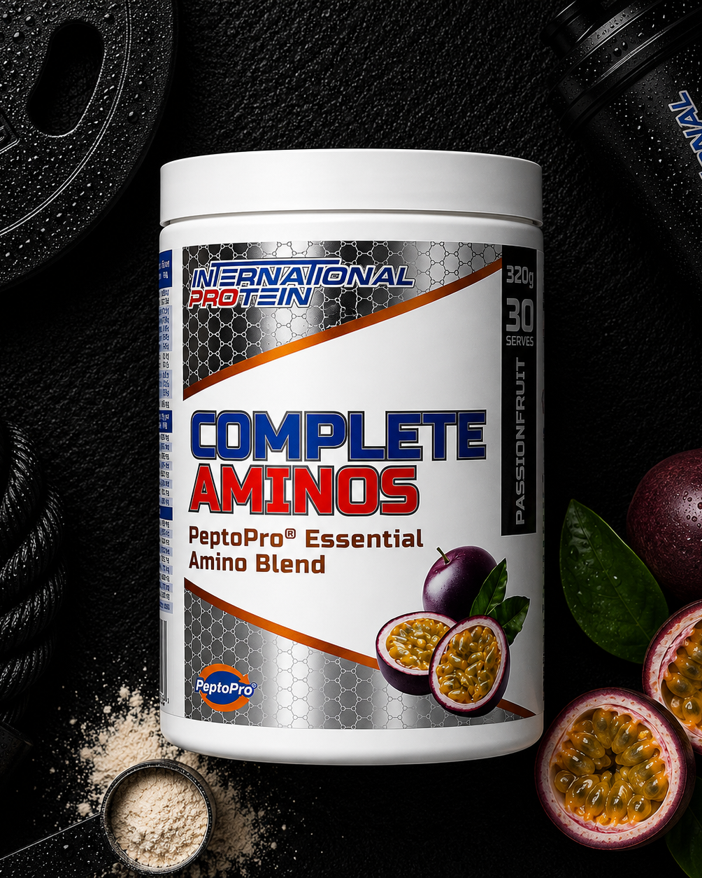 International Protein Complete Aminos supplement container with passion fruit on a dark background