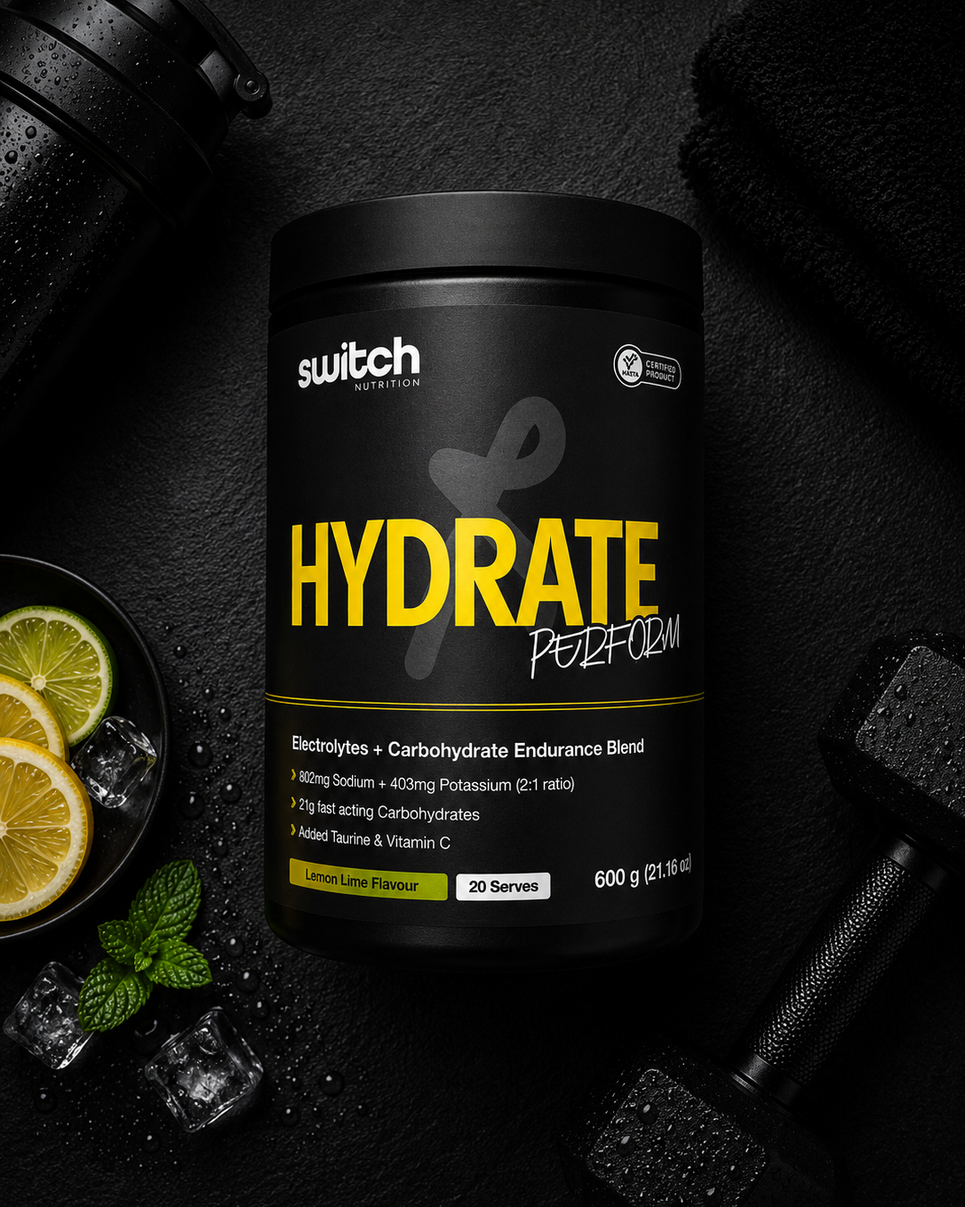 Black supplement container labeled 'Hydrate' with lemon slices and ice cubes on a dark background