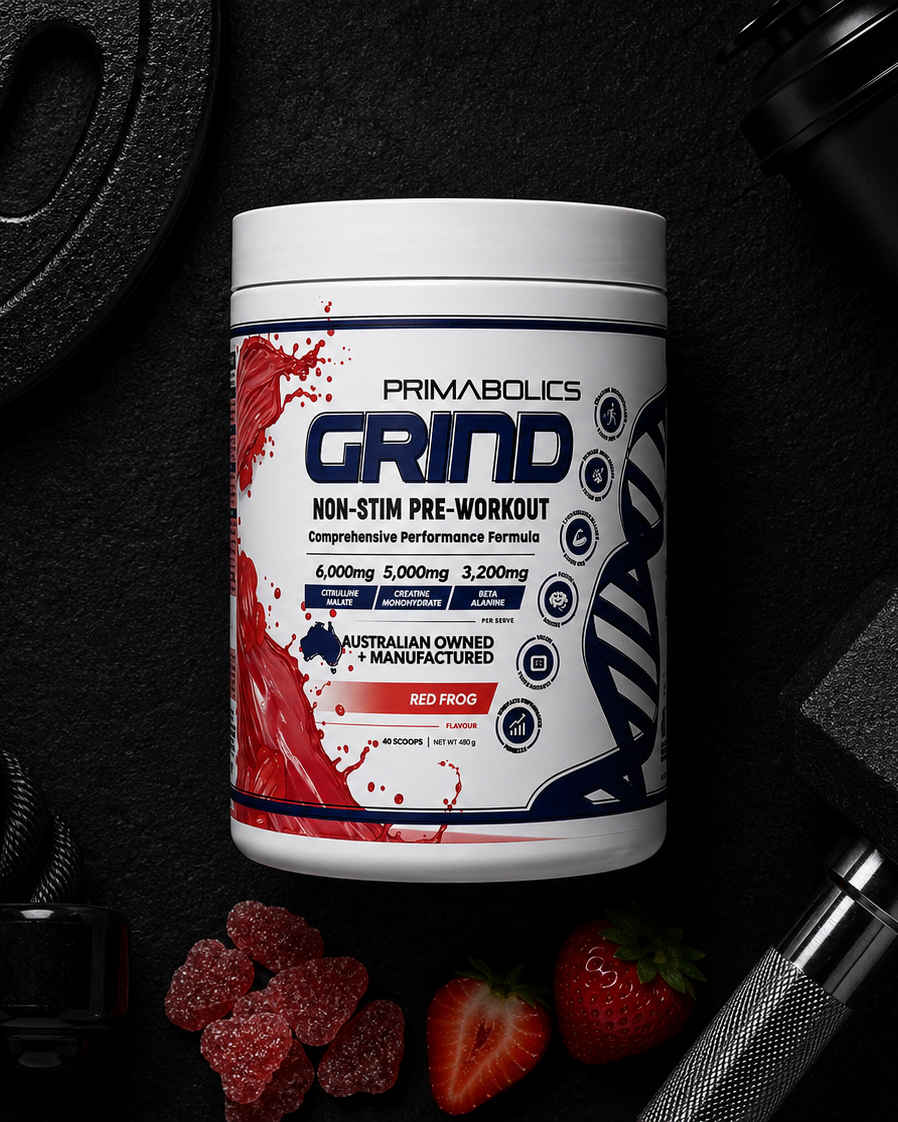 Primabolics Grind pre-workout supplement container on a dark background with fitness equipment.