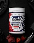 Primabolics Grind pre-workout supplement container on a dark background with fitness equipment.