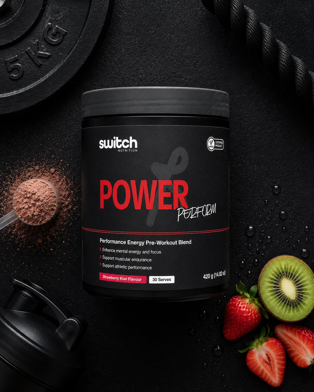Supplement container labeled 'Power' by Switch Nutrition on a dark surface with fruits and a weight plate.
