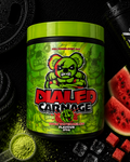 Green supplement container labeled 'Dialed Carnage' with watermelon slices and scoop on a dark background