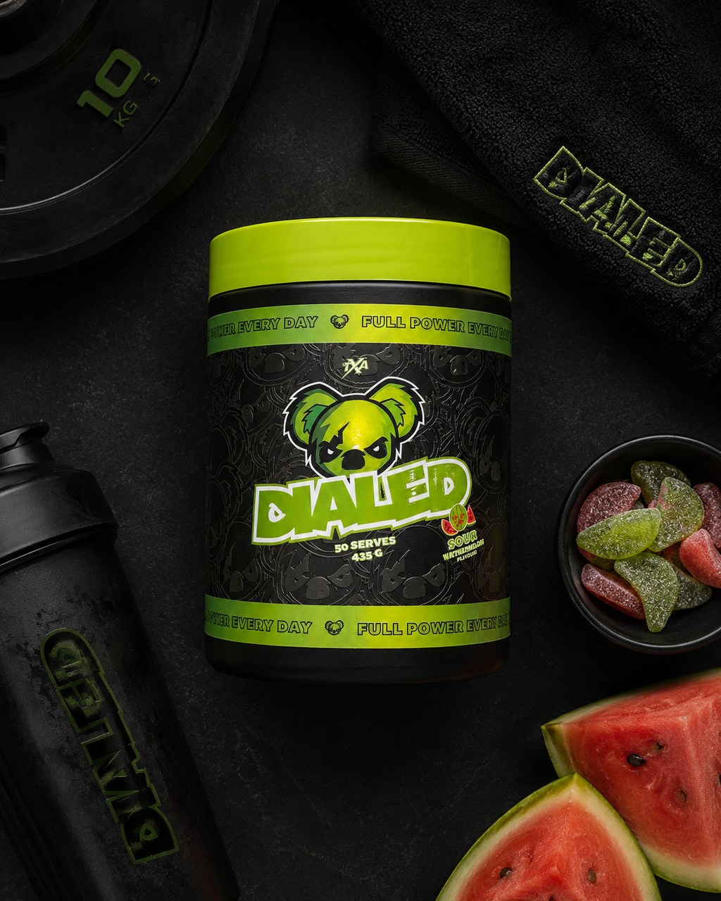 Dioled supplement container with green lid on a dark surface with watermelon and gummy bears.