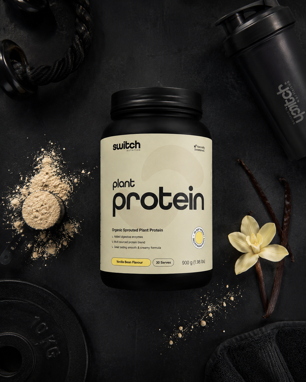 Switch plant protein bottle on a dark surface with vanilla beans and protein powder.