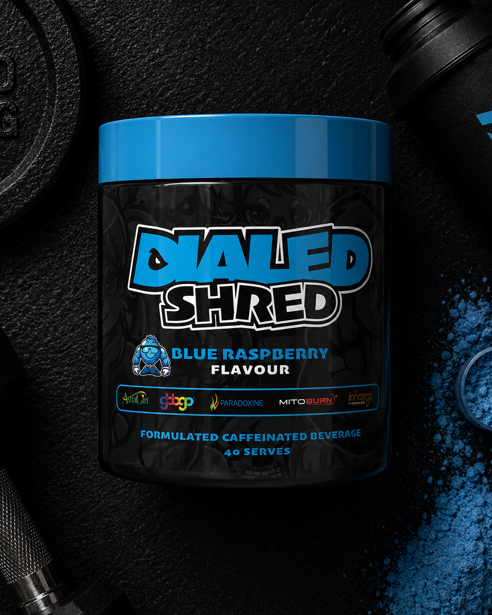 Container of DIALED SHRED supplement with blue powder and gym equipment in the background