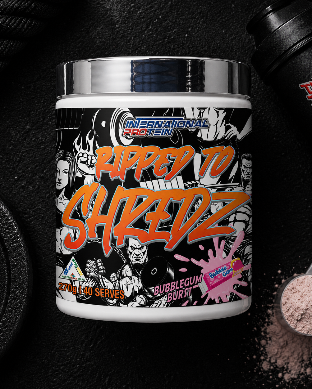 International Protein Ripped to Shredz supplement container with protein powder scoop and weight on a dark background