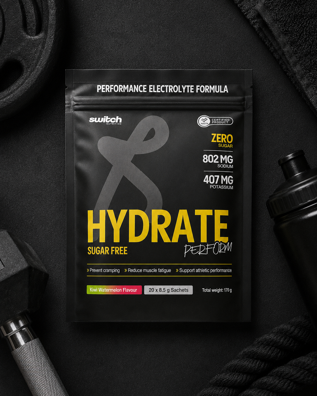 Hydration supplement package with gym equipment on a dark background