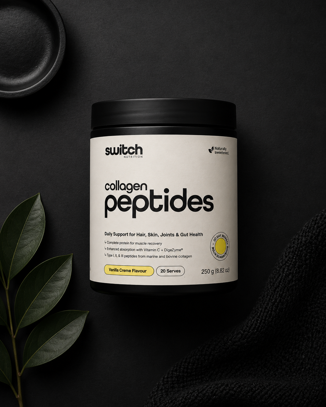 Container of switch collagen peptides on a dark background with leaves.